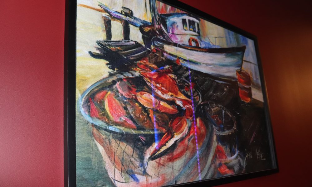 A painting depicting a fishing boat
