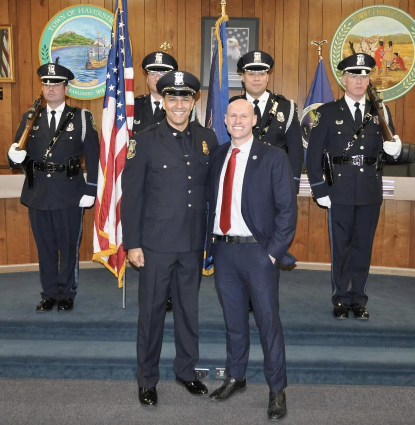 Two smiling men in their formal military uniforms