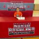 A man sitting at a table dedicated to North Rockland Highschool